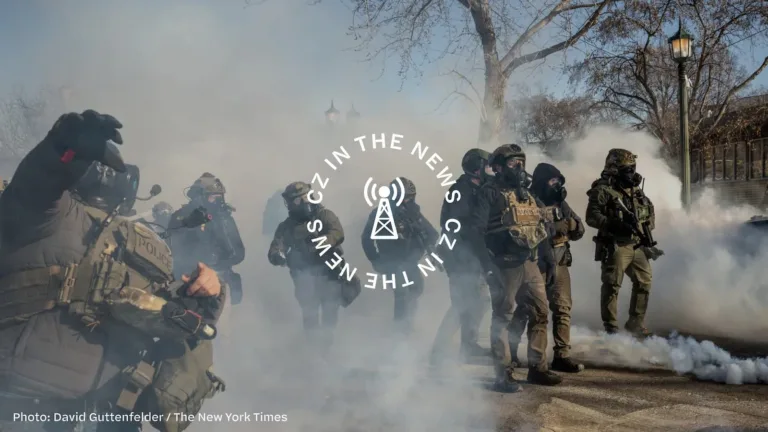 A group of armed soldiers in tactical gear moving through thick smoke in an outdoor setting.